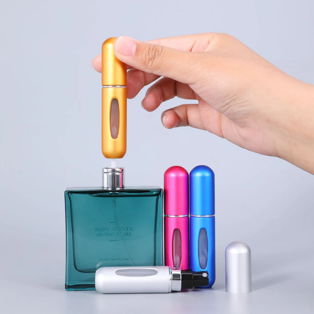 Portable Mini Refillable Perfume Bottle With Spray. (Random Colors)